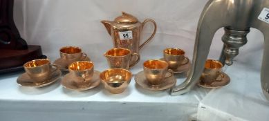 A Jersey pottery gilded coffee set. COLLECT ONLY