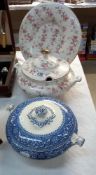 A floral tureen and matching tureen holder (plate) and a blue and white tureen