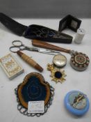 A good lot of needlework items including tape measures, scissors etc.,