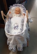 A doll in a Moses basket, COLLECT ONLY.