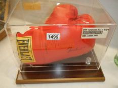 A cased signed Mohamed Ali boxing glove, COLLECT ONLY.