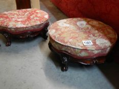 A pair of mahogany cabriole leg foot stools.