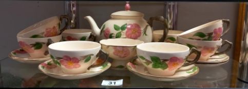A floral pottery tea set