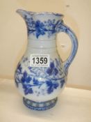 A Victorian blue and white jug with lozenge mark to base.