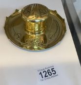 An art nouveau brass inkwell