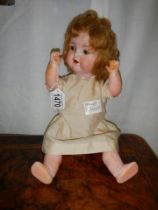 An Armand Marseille porcelain headed doll.