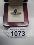 A blue and white stone 9ct gold ring,
