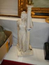 A figural table lamp base.