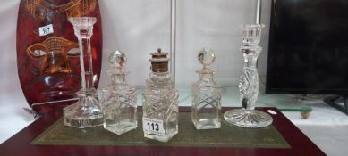 4 vintage condiment bottles and 2 candlesticks