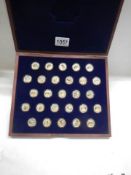 A limited edition cased set of 27 gold plated commemorative coins (Capitals of Europe).