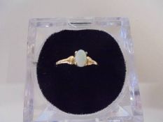 A 9ct gold ring set opal, size N, 1 gram.