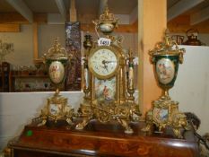 A superb three piece clock garniture with sevres panes, in working order, with key COLLECT ONLY.