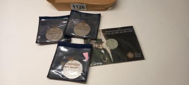 A Churchill silver £20 coin in presentation pack and 3 Guernsey Churchill £5 coins
