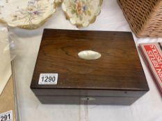 A Victorian jewellery box with mother of pearl inlaid lid