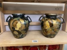 A pair of lustre hand decorated twin handled vases