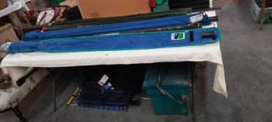 A large lot of fishing rods, empty rod holders, new large net, tackle box etc COLLECT ONLY