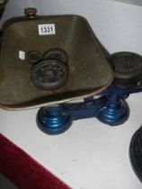 A set of kitchen scales with weights.