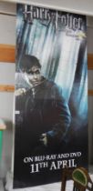 A Harry Potter and the Deathly Hallows Part 1 standee featuring Harry Potter, COLLECT ONLY.