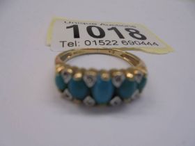 A 9ct gold ring set five green stones, size N, 2.8 grams.