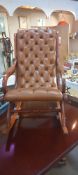 A leather deep buttoned rocking chair, tan in colour COLLECT ONLY