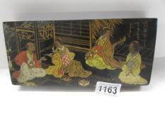 A Japanese lacquer glove box.