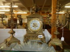 A three piece brass clock garniture, in good working order, COLLECT ONLY.