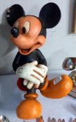 A large Disney figure of a seated Mickey Mouse (slight a/f to ear)