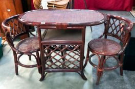 A dark bamboo oval kitchen/conservatory table and 2 chairs COLLECT ONLY