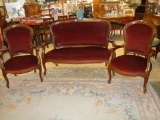 A mahogany framed cabriole leg three piece suite (some damage to upholstery on settee). COLLECT