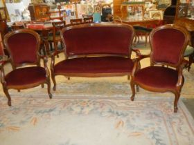 A mahogany framed cabriole leg three piece suite (some damage to upholstery on settee). COLLECT