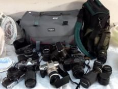 A quantity of 35mm cameras and lenses etc