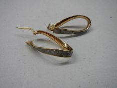 A superb quality pair of 9ct gold earrings.
