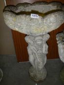 A garden bird bath with figural plinth, COLLECT ONLY.