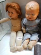 Two mid 20th century cloth dolls.