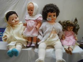 Four vintage dolls.