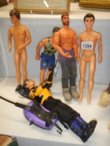 A quantity of Action man dolls.