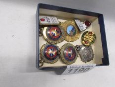 A quantity of fobs and badges.