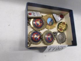 A quantity of fobs and badges.