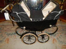 A mid 20th century Silver Cross twin dolls pram in excellent condition, COLLECT ONLY.