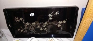 A black lacquered tray with floral decoration COLLECT ONLY
