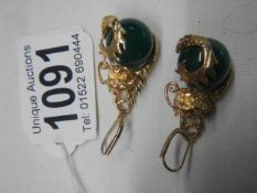 A good pair of yellow metal earrings with onyx ball in centres.