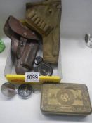 A mixed lot including WW1 brass tin, two gun holsters and two compasses.
