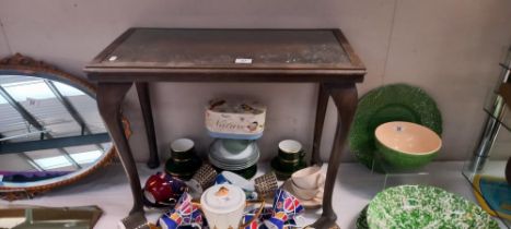 A dark wood side table with carved top under glass COLLECT ONLY