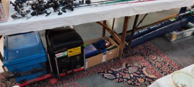 A large lot of fishing equipment including tackle boxes, brollies etc COLLECT ONLY