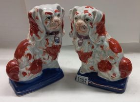 A pair of modern Victorian style Staffordshire spaniels