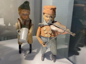 A 1930's Schuco clockwork violin boy and a drinking boy