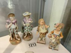 A pair of Dresden figurines and another pair of German figurines