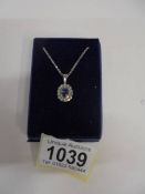 A white gold sapphire and diamond pendant, 3.8 grams.