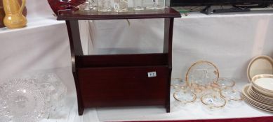 A dark wood stained magazine rack with leather insert on top COLLECT ONLY