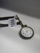 A ladies silver fob watch in need of attention,.